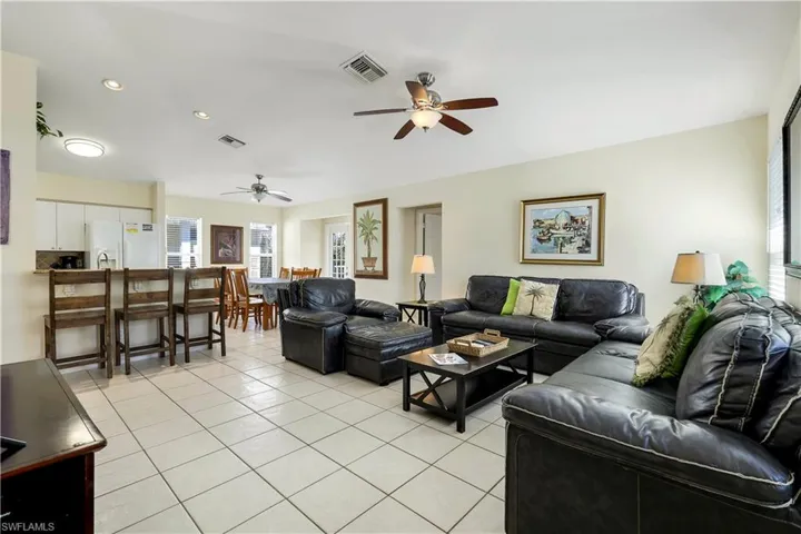 Tiled living room with ceiling fan