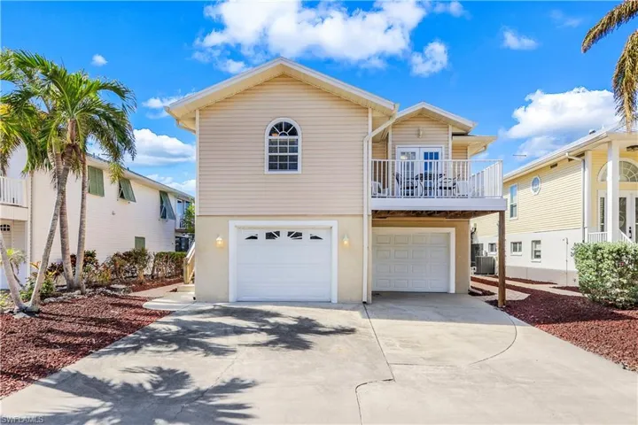 View of front of home featuring a garage