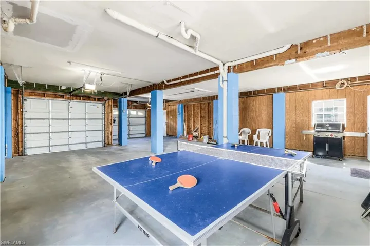 Garage featuring wood walls