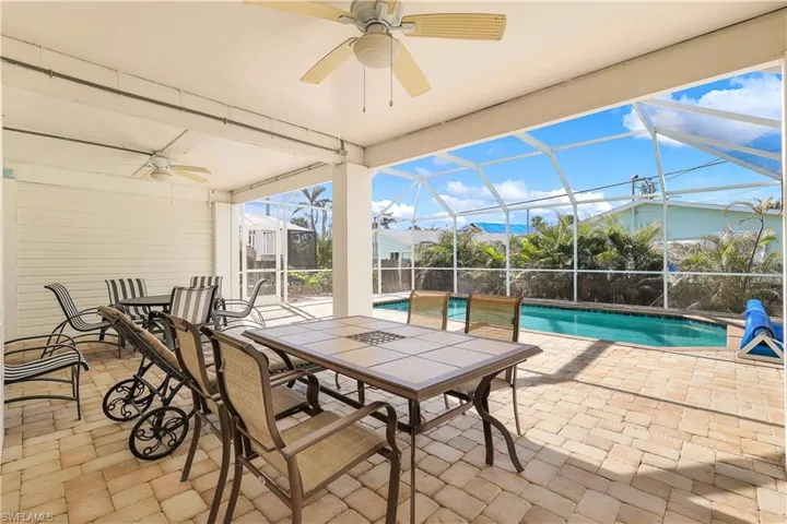 View of patio / terrace with ceiling fan and a lanai