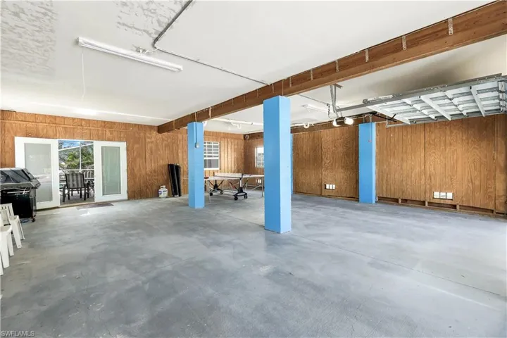 Basement featuring wooden walls