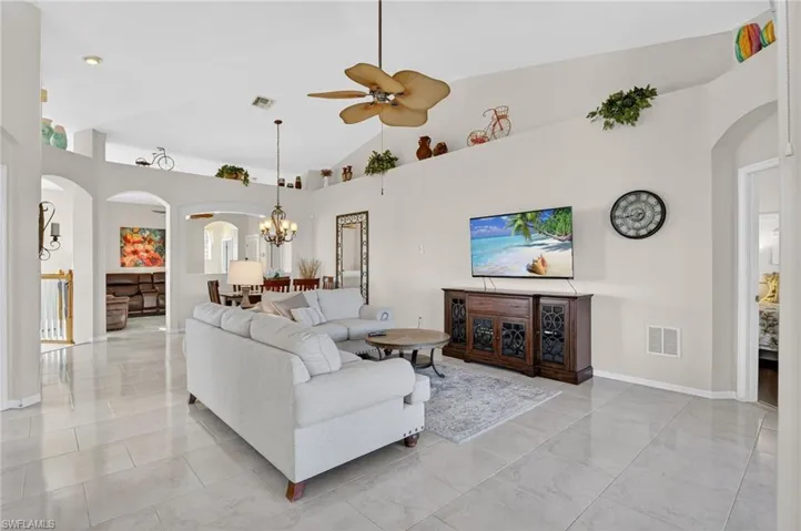 Spacious living room with lots of light pouring in.