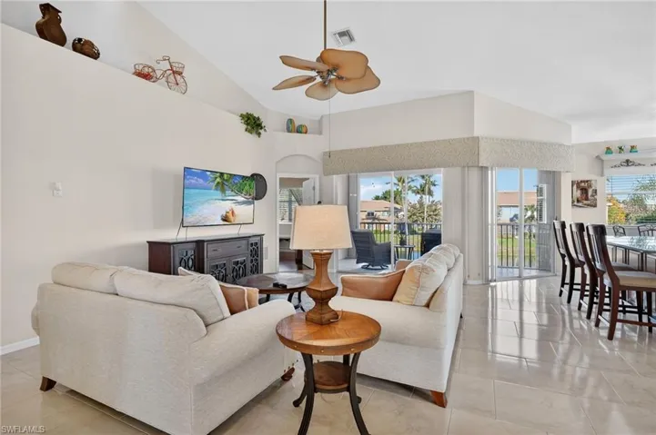 Spacious living room with lots of light pouring in.