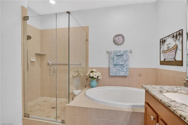 Primary bathroom and view of walk in shower