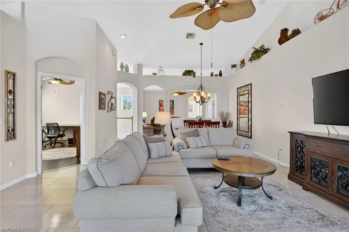 Spacious living room with lots of light pouring in.