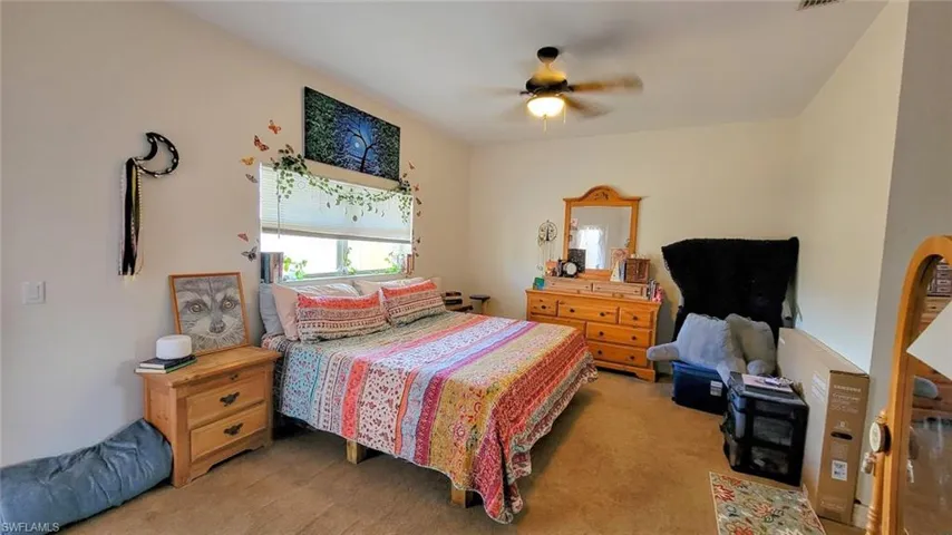 Bedroom with carpet floors and ceiling fan