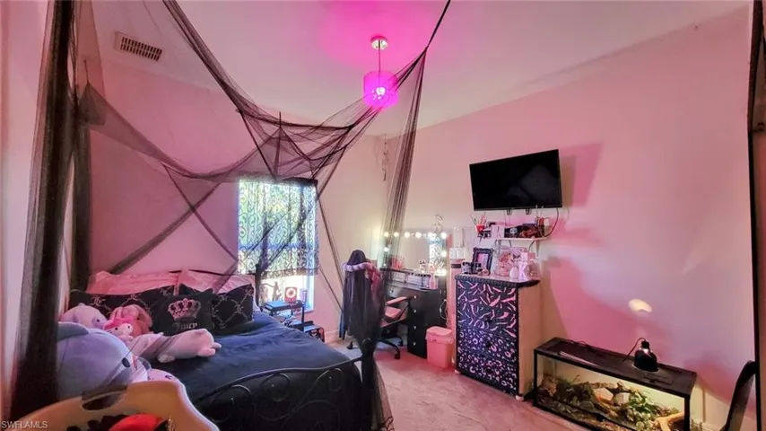 Bedroom featuring carpet flooring