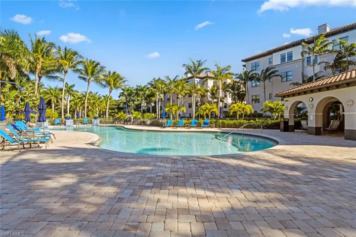 Community pool with a patio