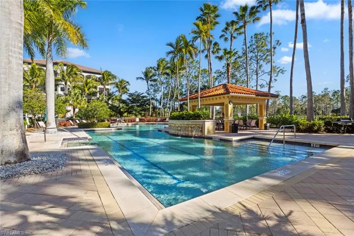 Community pool with a patio area and a gazebo