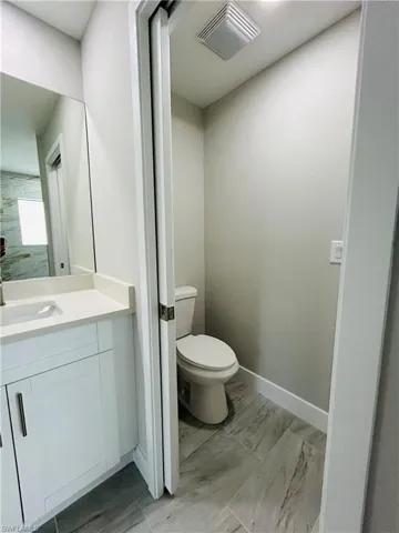 Bathroom featuring vanity and toilet