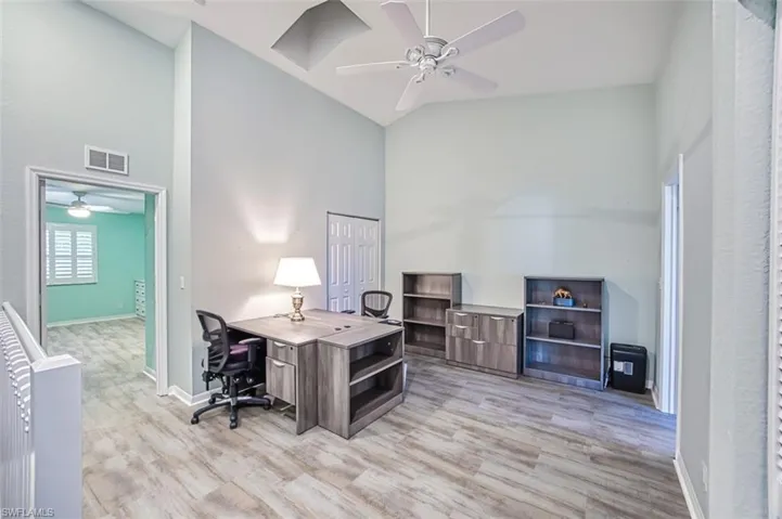 Office area featuring ceiling fan and light hardwood / wood-style flooring