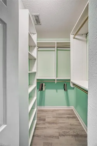 Washroom featuring separate washer and dryer and electric water heater