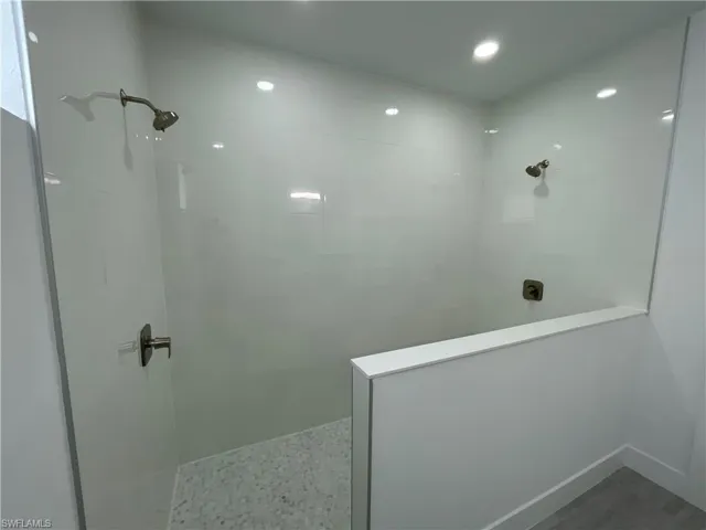 Bathroom featuring walk in shower and recessed lighting