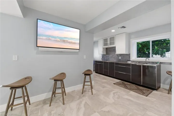 Lower level kitchenette and open recreational area