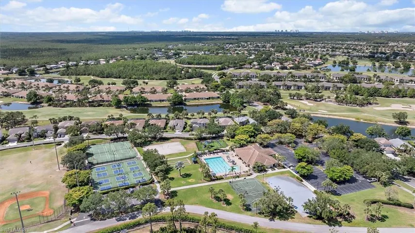 Aerial view featuring a water view, a residential view, and golf course view