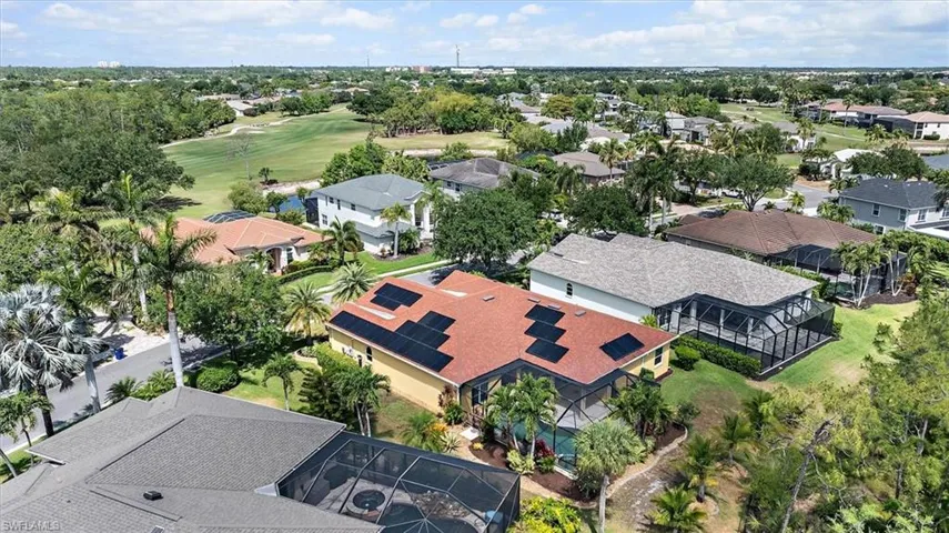 Bird's eye view with view of golf course and a residential view