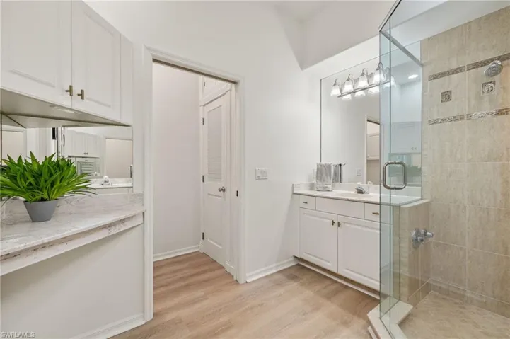 En suite bathroom, dual vanity and walk-in shower.