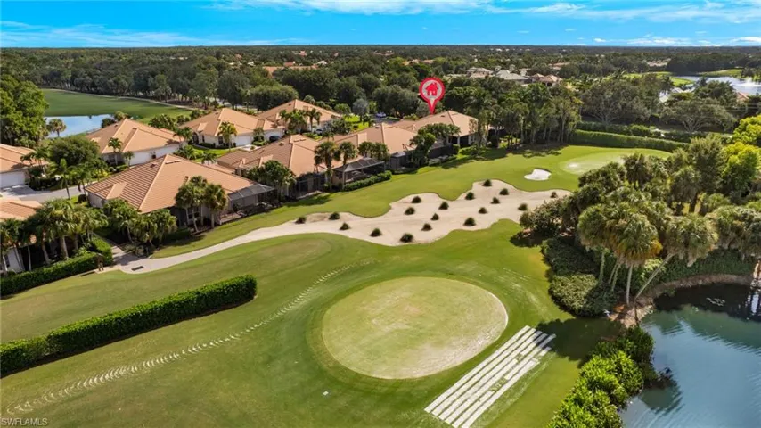 Birds eye view of property with a golf course view