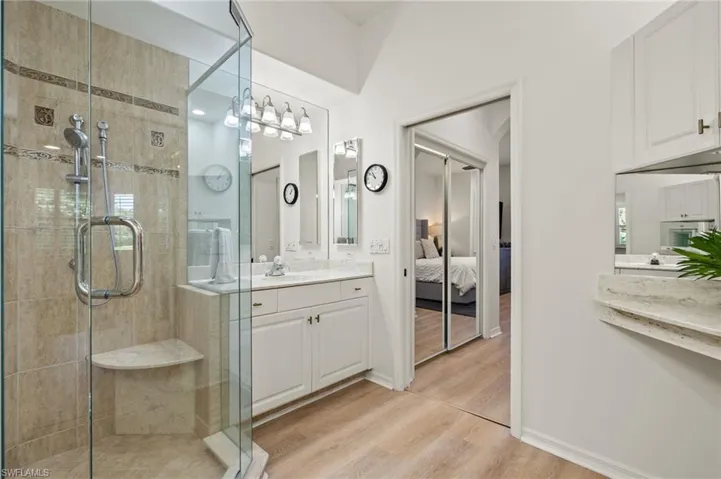En suite bathroom, dual vanity and walk-in shower.