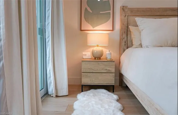 Bedroom with light wood-style floors