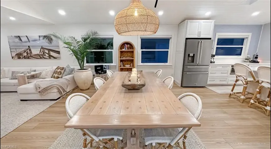 Dining space featuring light wood-style floors and recessed lighting