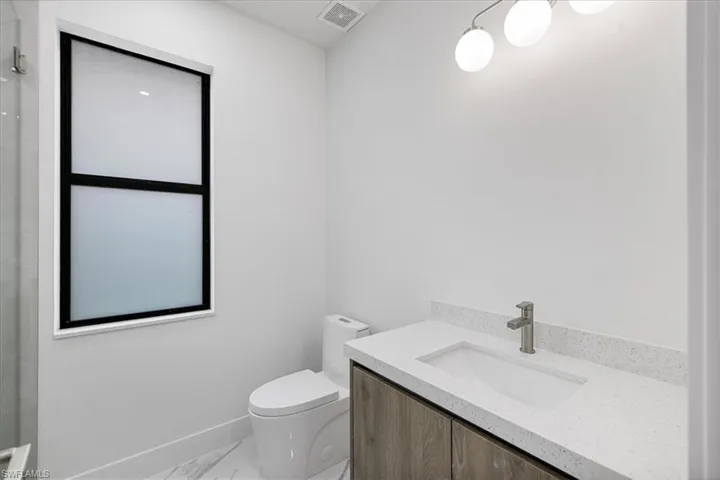 Bathroom with vanity and toilet