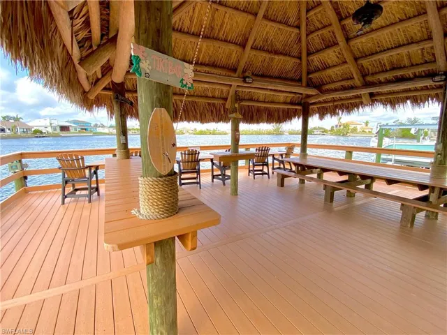 Dock area with a deck with water view and a gazebo