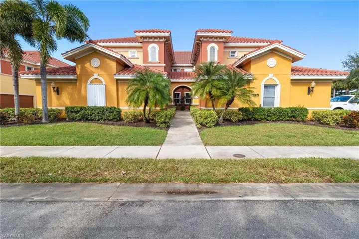 Mediterranean / spanish-style house featuring a front yard