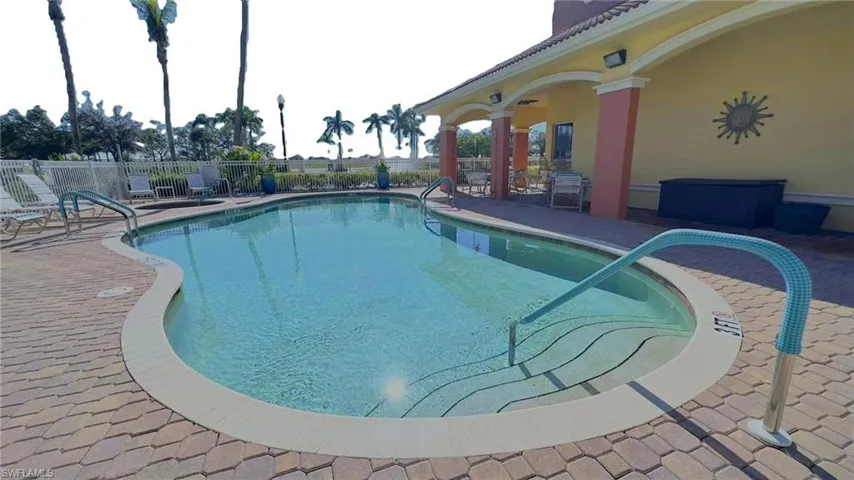 View of swimming pool with a patio area