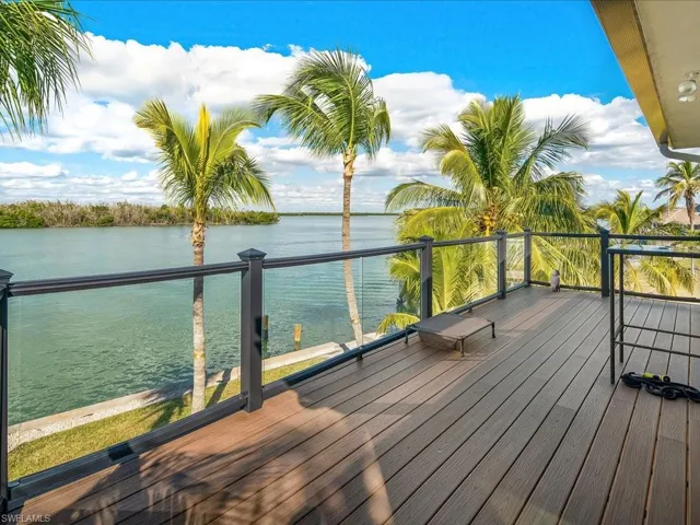 Wooden terrace featuring a water view