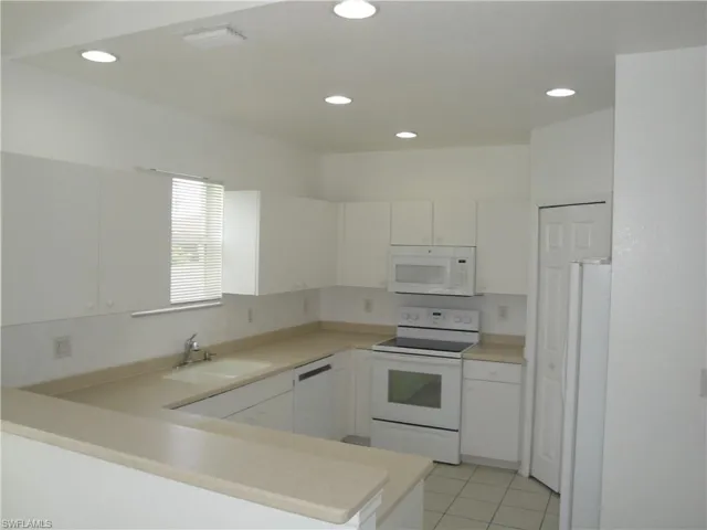 Solid surface counter and newer appliances.