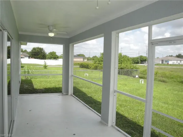 Long lanai with dual fan lights. Almost the full width of the home at 24.25 x 7.75 feet.