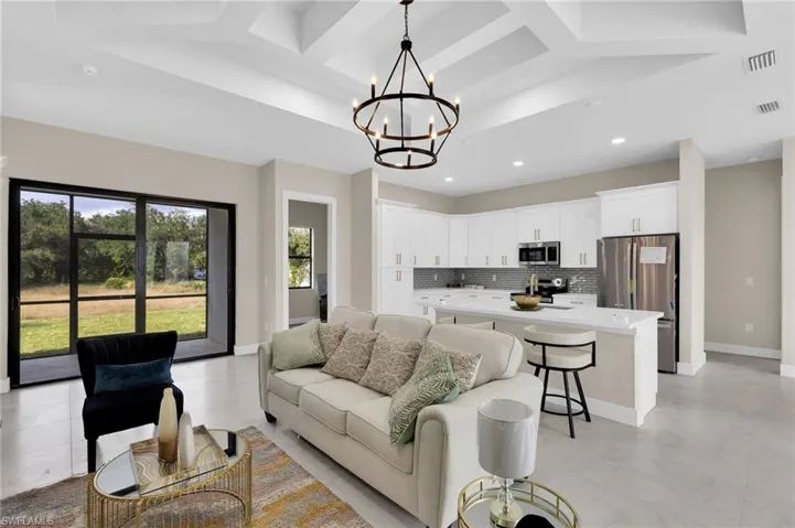 Living room with a chandelier and recessed lighting