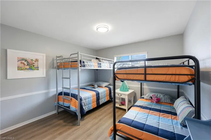 Bedroom with hardwood / wood-style floors