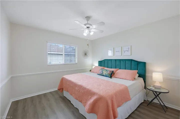 Bedroom featuring hardwood / wood-style flooring and ceiling fan