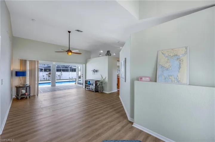 Living room featuring ceiling fan and wood-type flooring