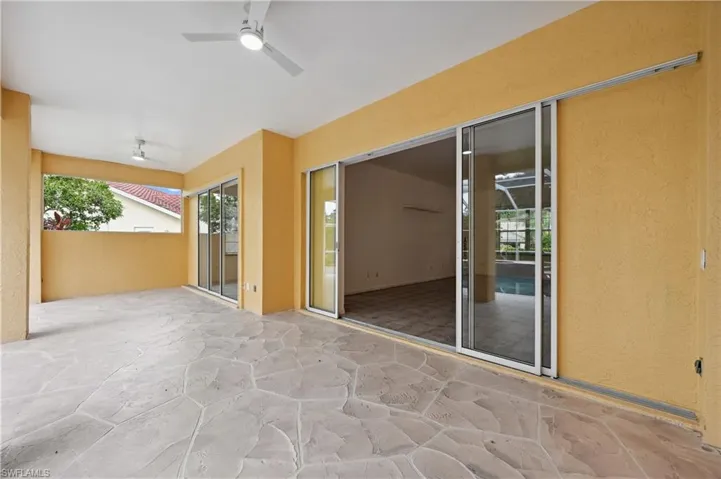 View of patio with a ceiling fan