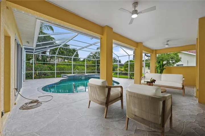 Virtually Staged Lanai Area and view of pool