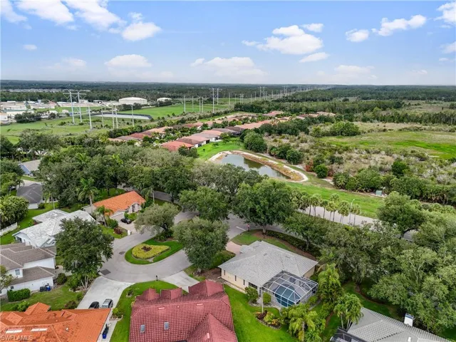 Aerial perspective of suburban area featuring a large body of water
