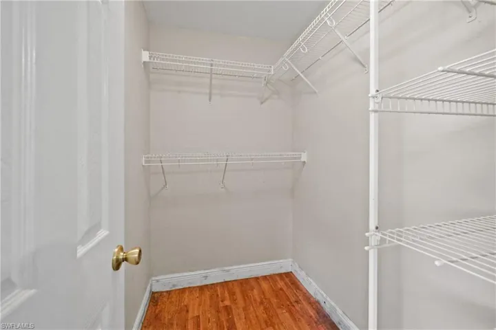 Spacious closet with wood finished floors