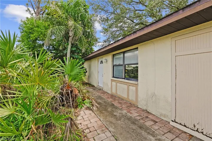 Property entrance with stucco siding