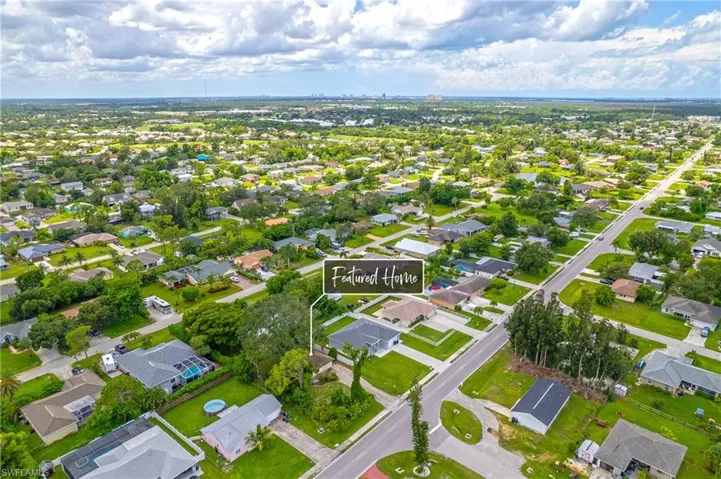 Aerial overview of property's location featuring nearby suburban area