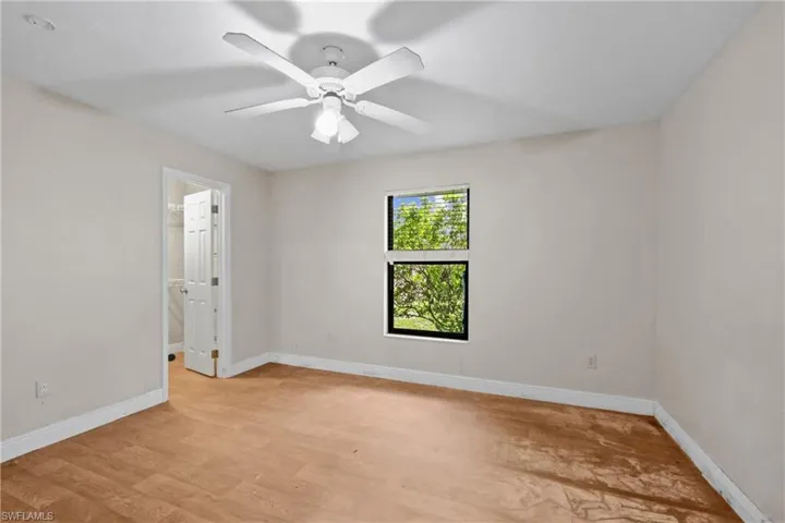 Unfurnished room with light wood-type flooring and ceiling fan