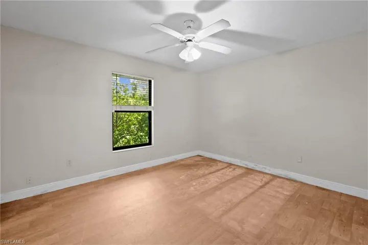 Unfurnished room featuring light wood-type flooring and ceiling fan