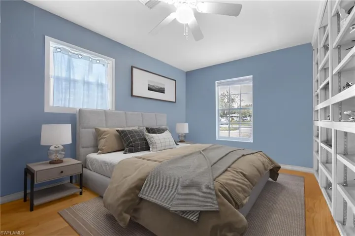 Bedroom with a ceiling fan and light wood finished floors