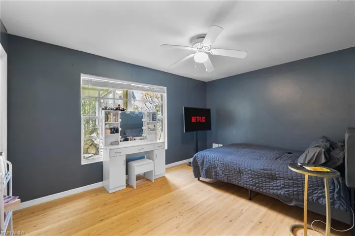 Bedroom featuring light wood-style floors and a ceiling fan