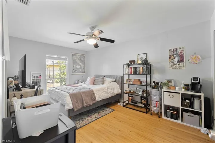 Bedroom with wood finished floors and a ceiling fan