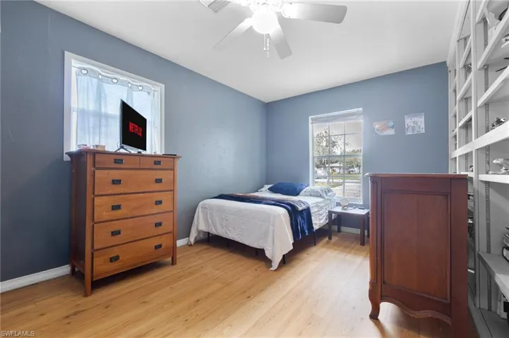 Bedroom featuring light wood-style floors and a ceiling fan
