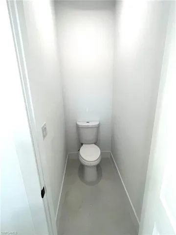 Bathroom featuring tile flooring and toilet
