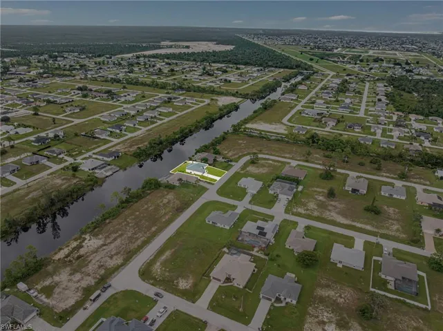 View of property location with nearby suburban area and a nearby body of water